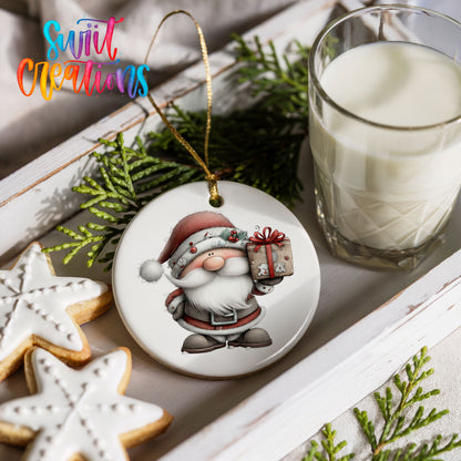 Santa Claus holding a wrapped Christmas gift ceramic Christmas ornament styled with holiday cookies and a candle