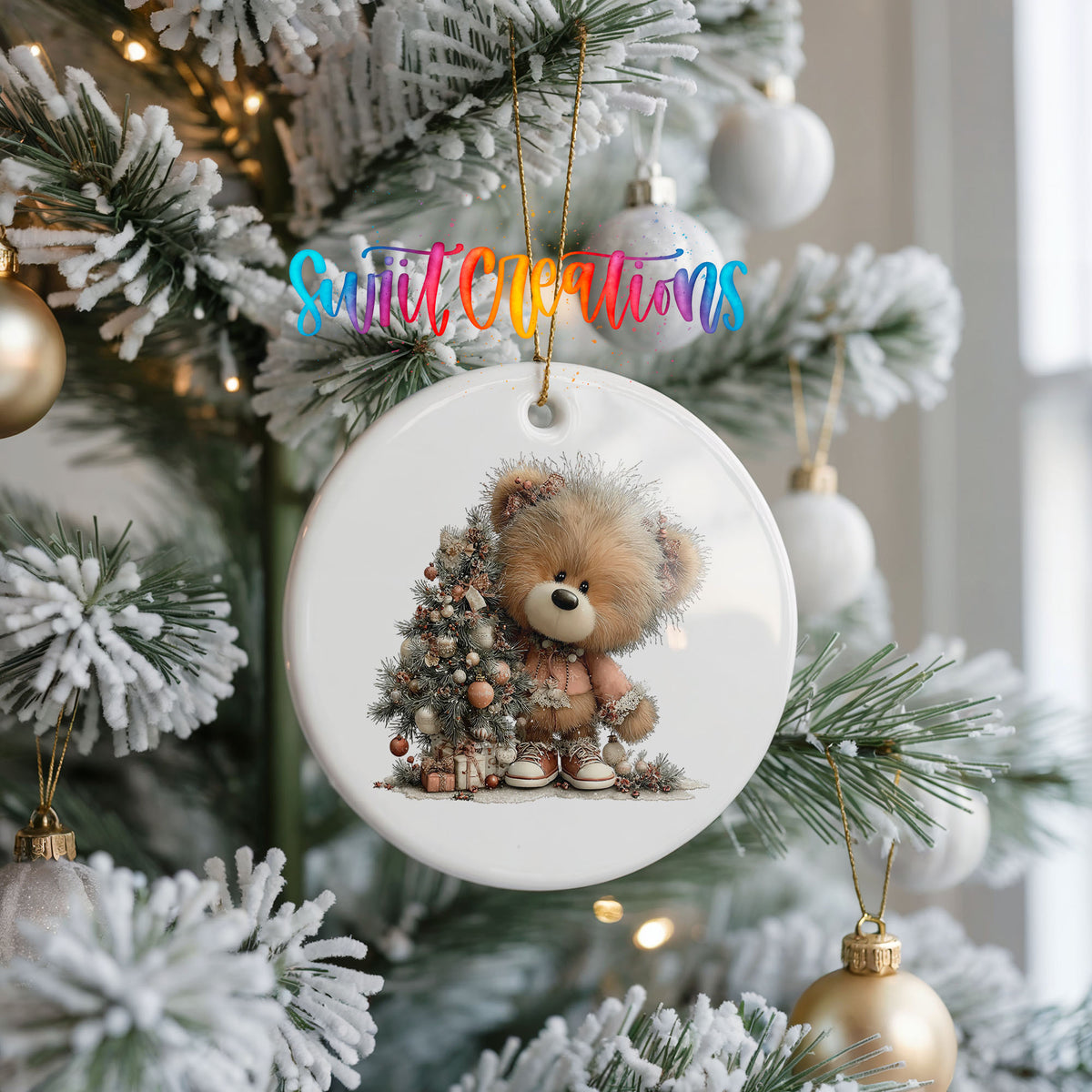 teddy bear sitting beside a decorated Christmas tree ceramic Christmas ornament hanging on a frosted Christmas tree