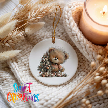teddy bear sitting beside a decorated Christmas tree ceramic Christmas ornament styled on a cozy knit blanket