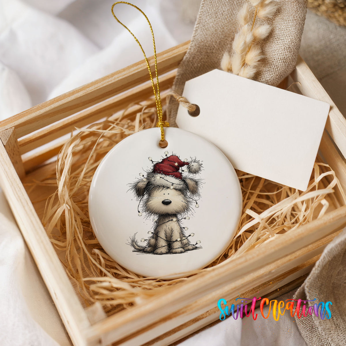 fluffy puppy in a Santa hat ceramic Christmas ornament displayed in a wooden gift crate