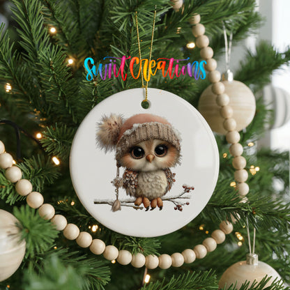 winter owl perched on a snowy branch ceramic Christmas ornament hanging on a green Christmas tree