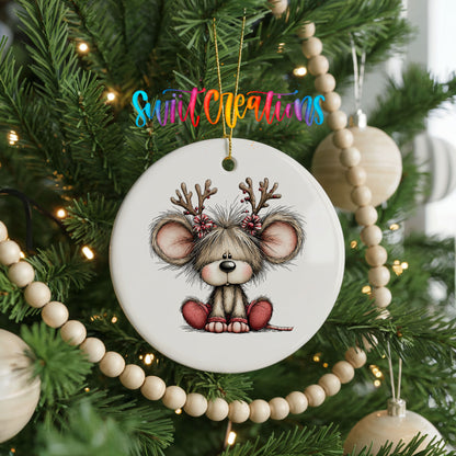 Christmas mouse wearing reindeer antlers and a red scarf ceramic Christmas ornament hanging on a green Christmas tree