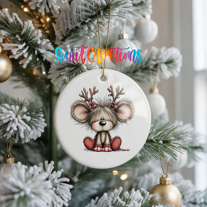 Christmas mouse wearing reindeer antlers and a red scarf ceramic Christmas ornament hanging on a frosted Christmas tree