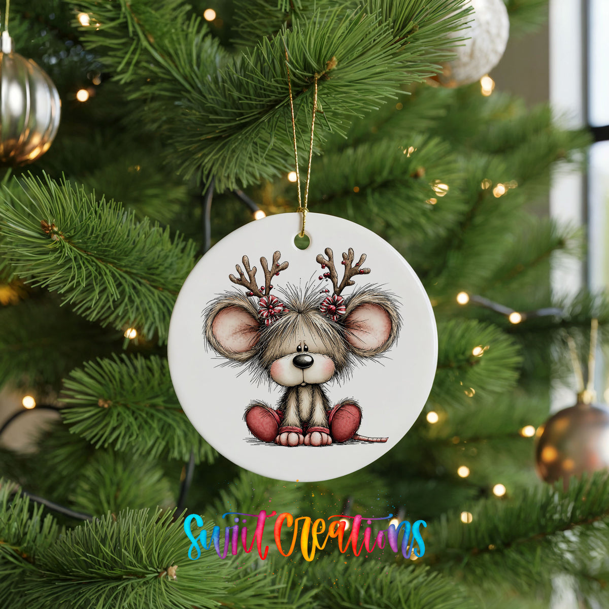 Christmas mouse wearing reindeer antlers and a red scarf ceramic Christmas ornament hanging on a lit Christmas tree
