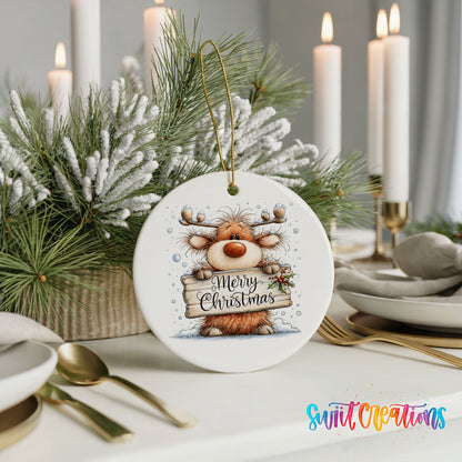 reindeer holding a Merry Christmas sign ceramic Christmas ornament shown in a holiday table setting