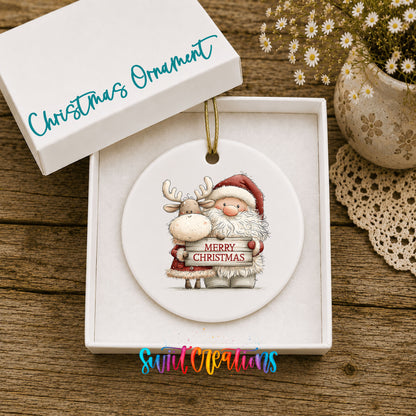 Santa Claus hugging a reindeer holding a Merry Christmas sign ceramic Christmas ornament presented in a gift box