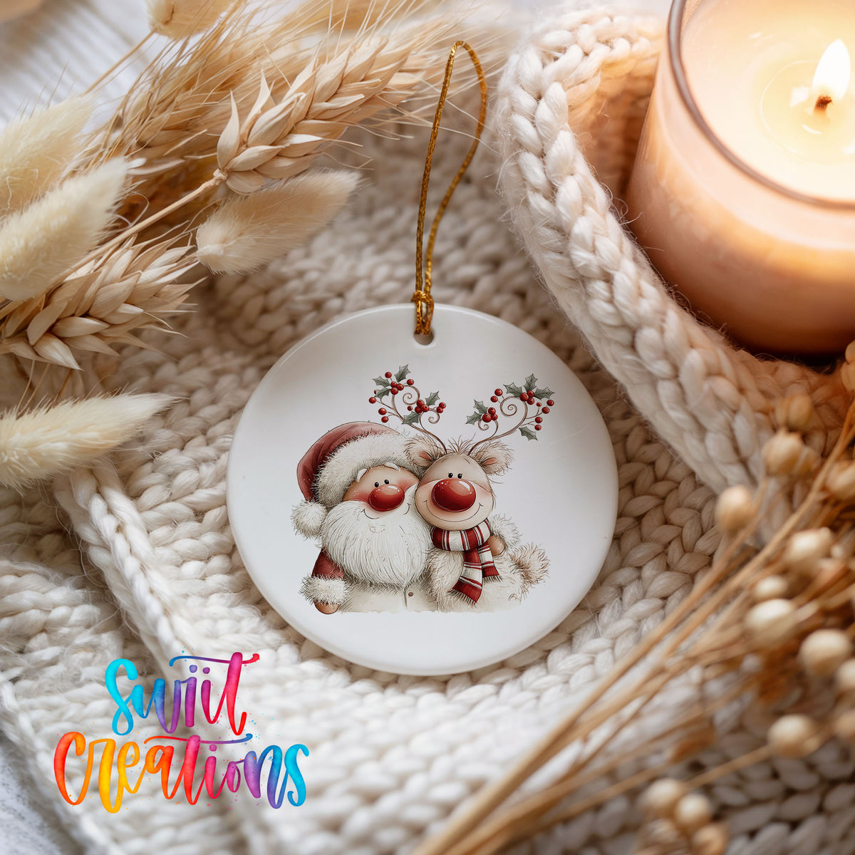 Santa Claus hugging a reindeer with holly antlers ceramic Christmas ornament styled on a cozy knit blanket