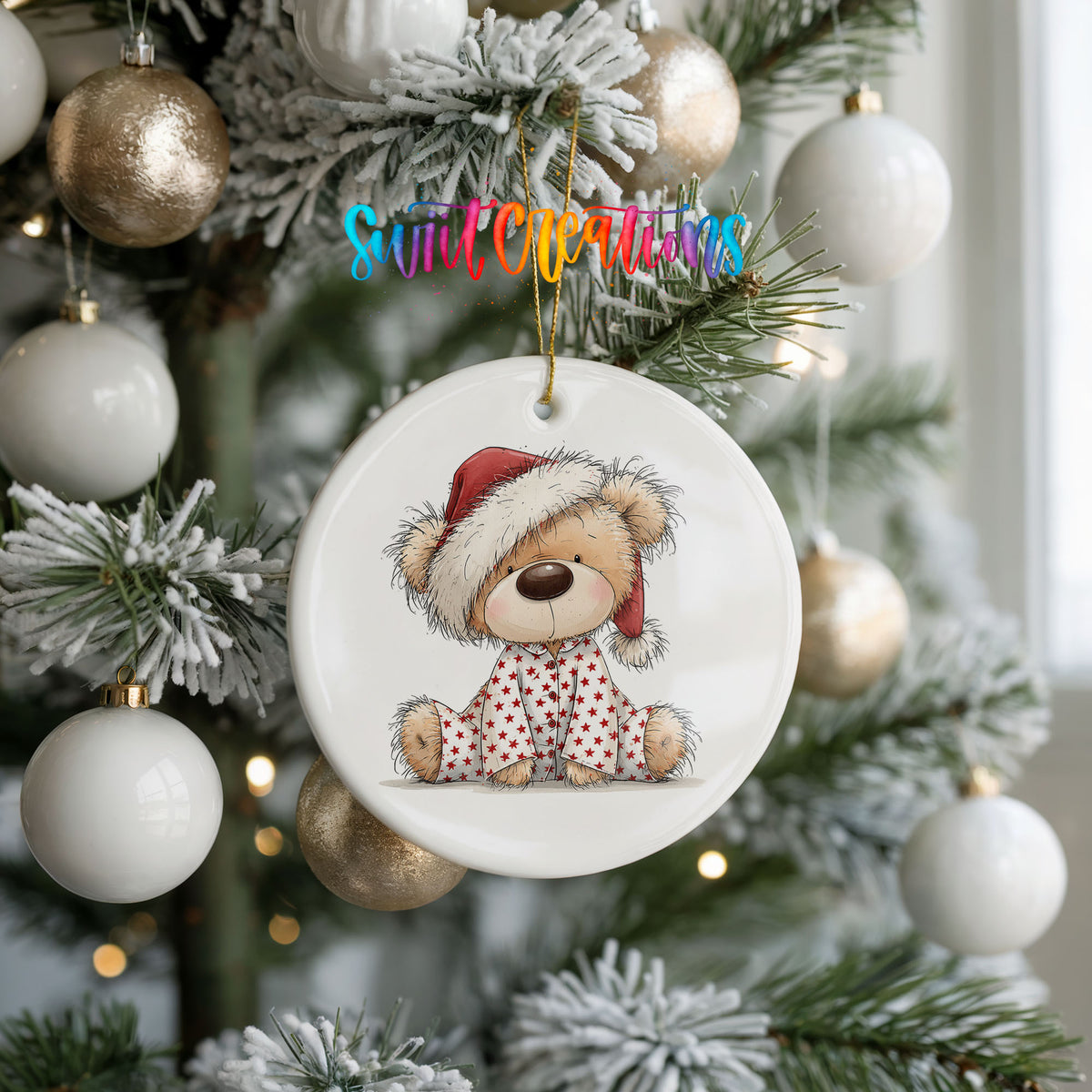 teddy bear in a Santa hat and pink polka dot scarf ceramic Christmas ornament hanging on a frosted tree with ornaments