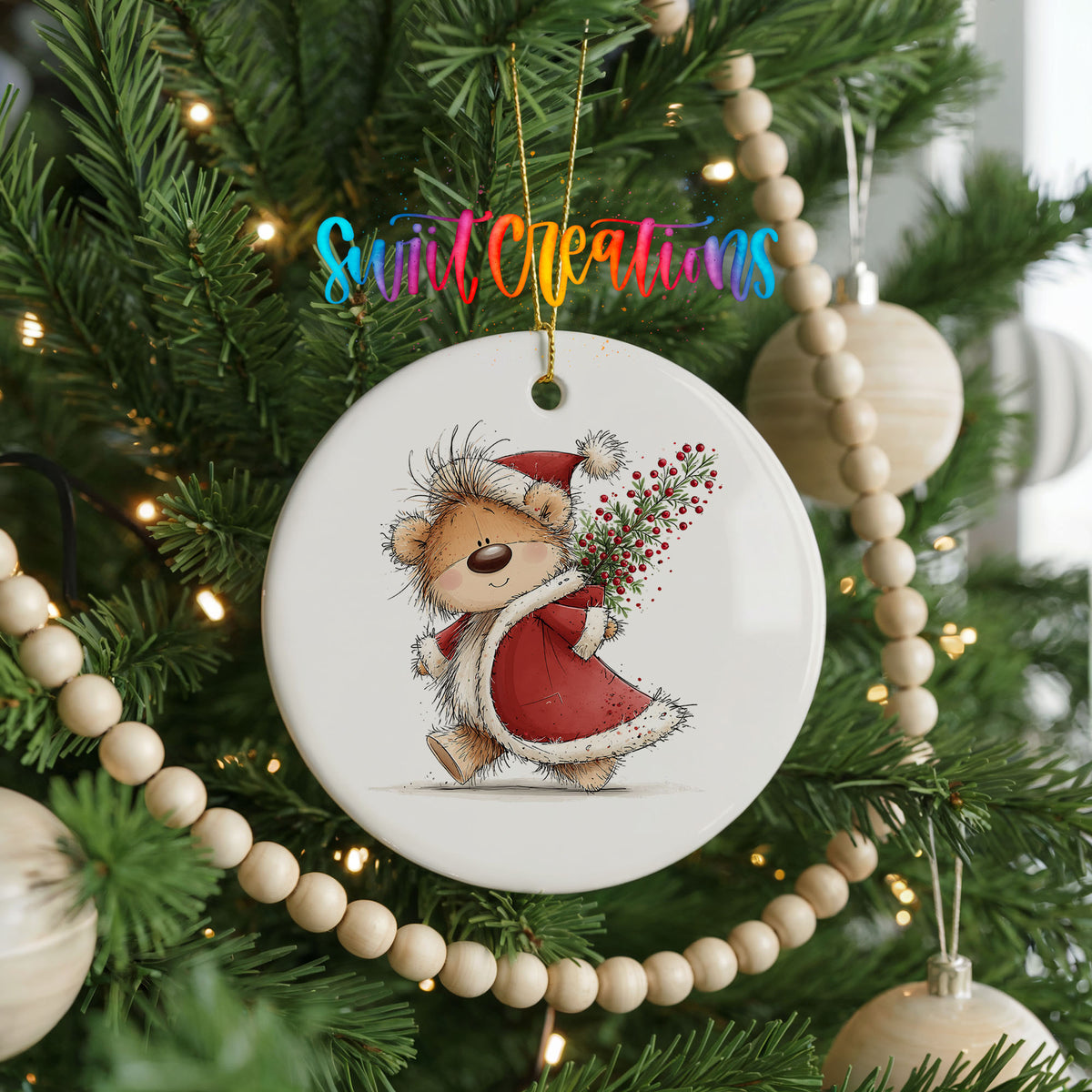 teddy bear carrying a red Christmas sack with winter greenery ceramic Christmas ornament hanging on a green Christmas tree