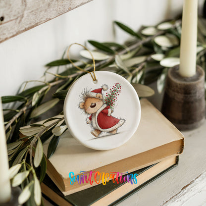 teddy bear carrying a red Christmas sack with winter greenery ceramic Christmas ornament styled on stacked books with greenery