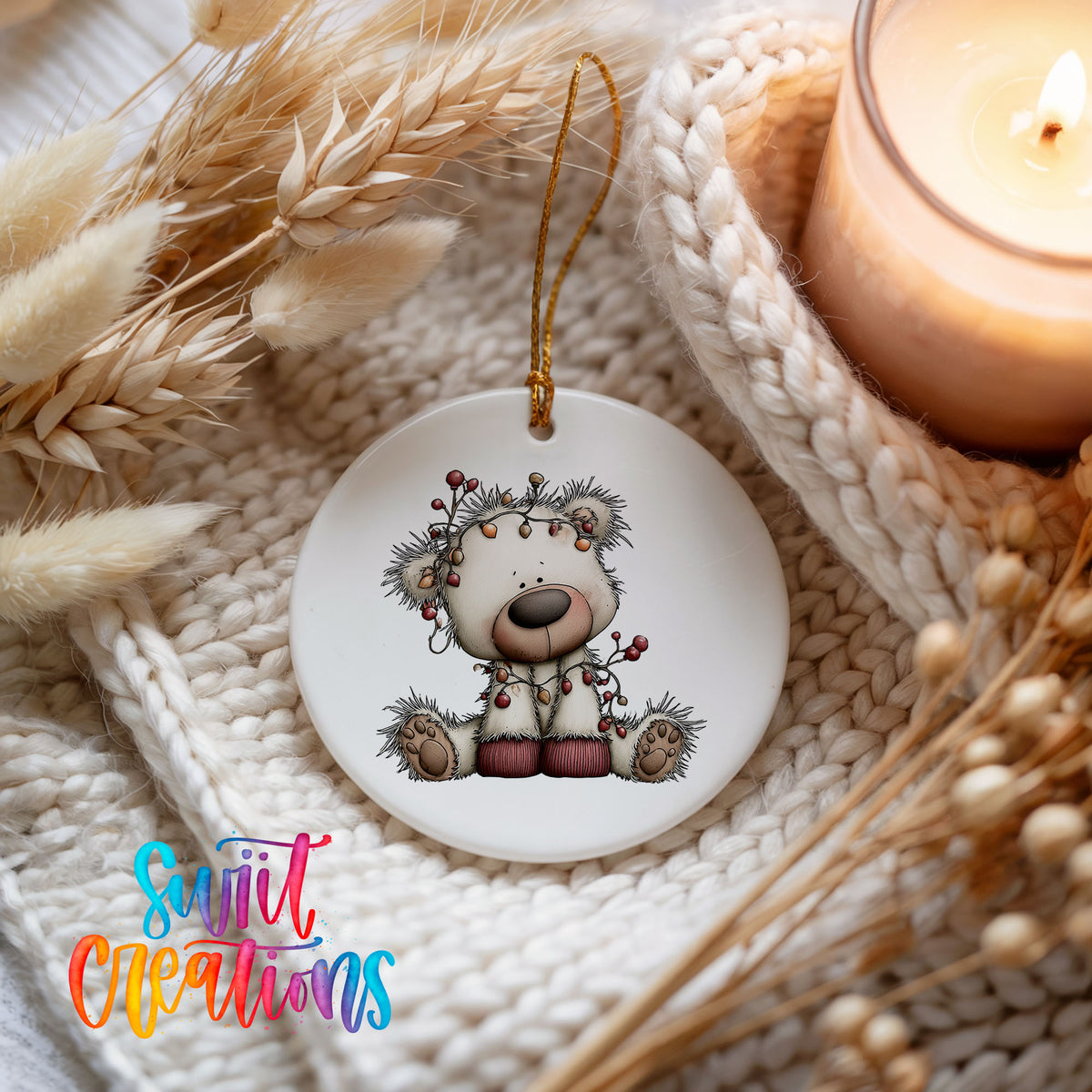 reindeer with decorated antlers and winter ornaments ceramic Christmas ornament styled on a cozy knit blanket