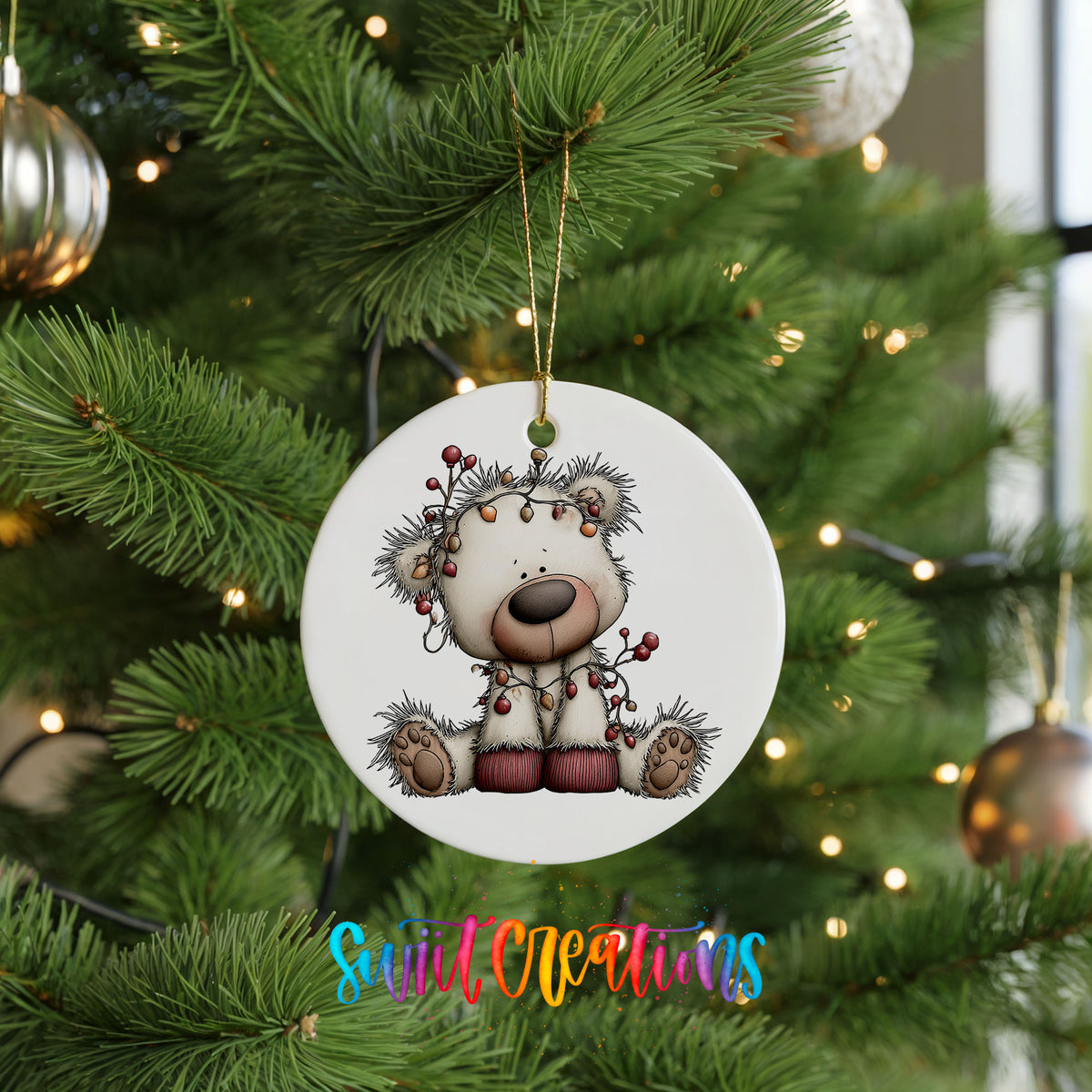 reindeer with decorated antlers and winter ornaments ceramic Christmas ornament hanging on a lit Christmas tree