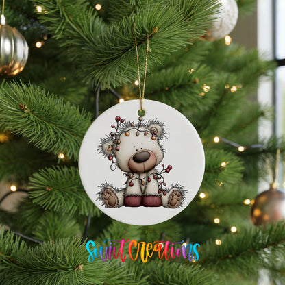 reindeer with decorated antlers and winter ornaments ceramic Christmas ornament hanging on a lit Christmas tree