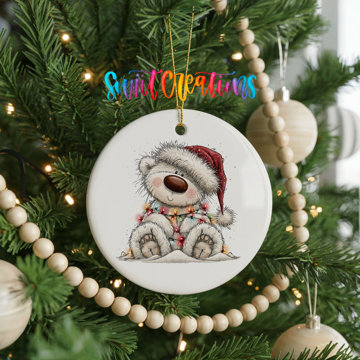 polar bear in a Santa hat and striped scarf ceramic Christmas ornament hanging on a green Christmas tree