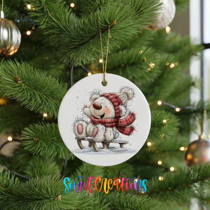 polar bear in a red winter scarf playing in the snow ceramic Christmas ornament hanging on a lit Christmas tree