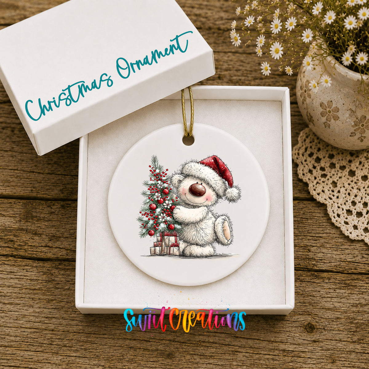 polar bear beside a decorated Christmas tree and gifts ceramic Christmas ornament presented in a gift box