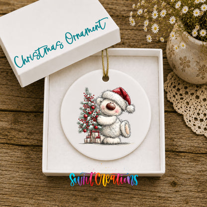 polar bear beside a decorated Christmas tree and gifts ceramic Christmas ornament presented in a gift box