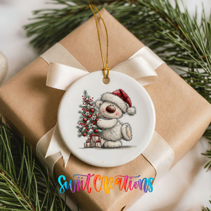 polar bear beside a decorated Christmas tree and gifts ceramic Christmas ornament displayed on a wrapped Christmas gift