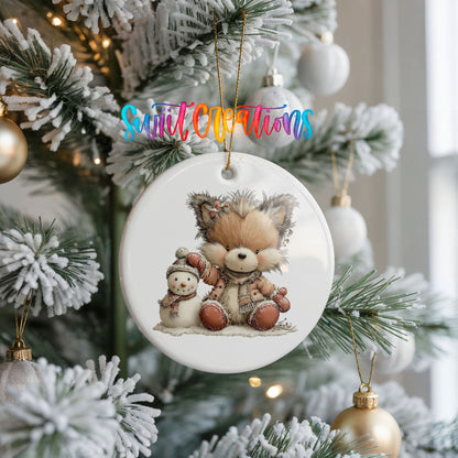 winter fox cuddling a small snowman ceramic Christmas ornament hanging on a frosted Christmas tree