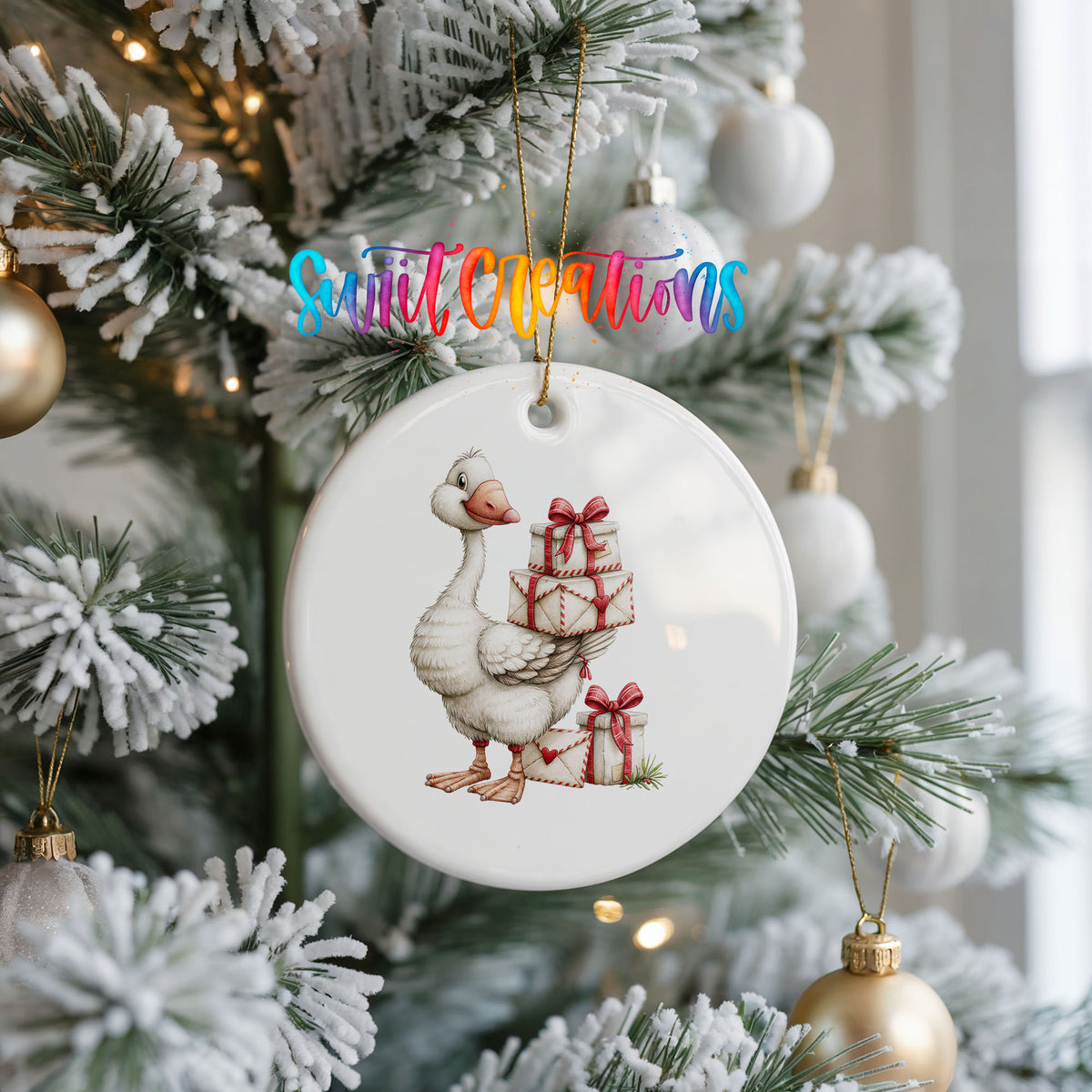 Christmas goose carrying a stack of wrapped gifts ceramic Christmas ornament hanging on a frosted Christmas tree