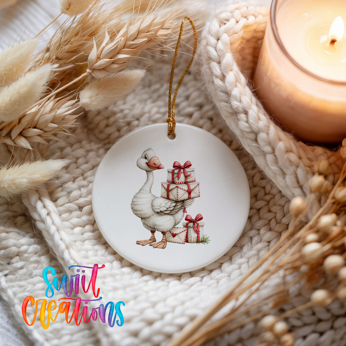 Christmas goose carrying a stack of wrapped gifts ceramic Christmas ornament styled on a cozy knit blanket