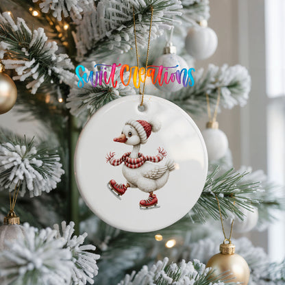 ice skating Christmas goose in a striped scarf ceramic Christmas ornament hanging on a frosted Christmas tree