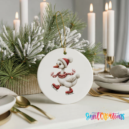 ice skating Christmas goose in a striped scarf ceramic Christmas ornament shown in a holiday table setting