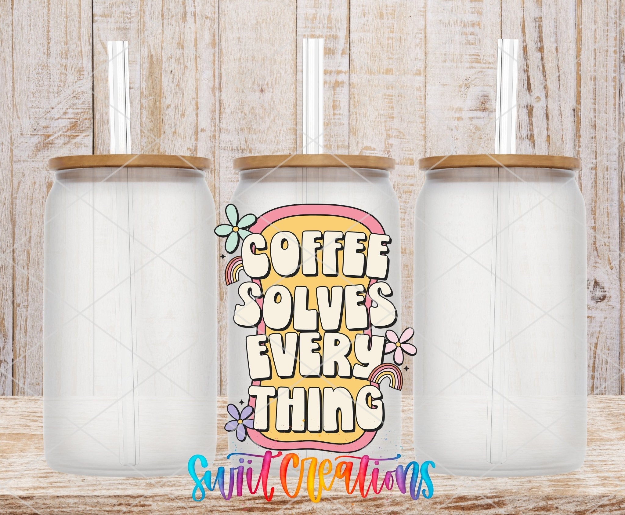 Coffee Solves Everything UV DTF transfer applied to a clear glass can set from Swiit Creations