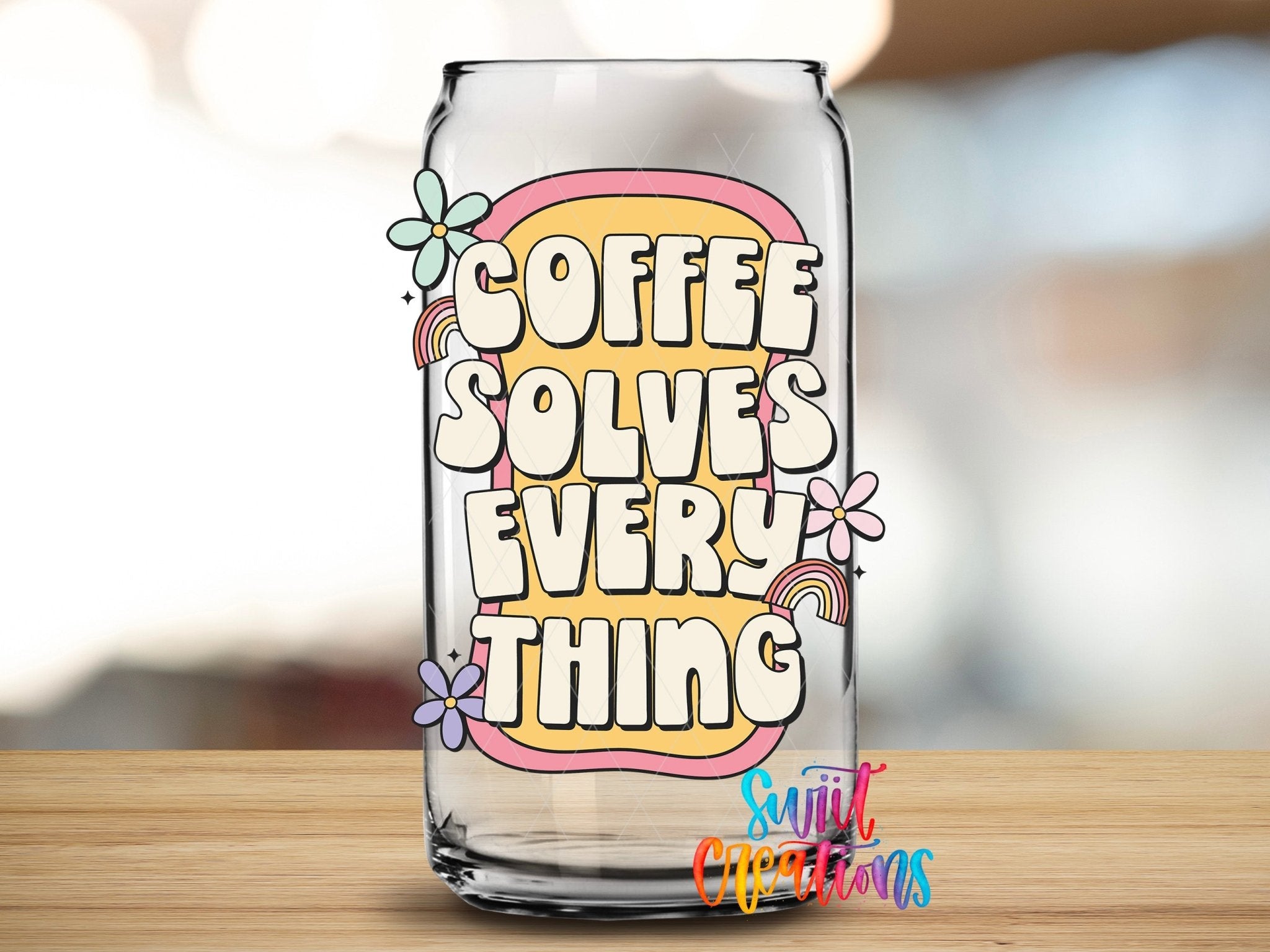 Coffee Solves Everything UV DTF transfer applied to a clear glass can from Swiit Creations