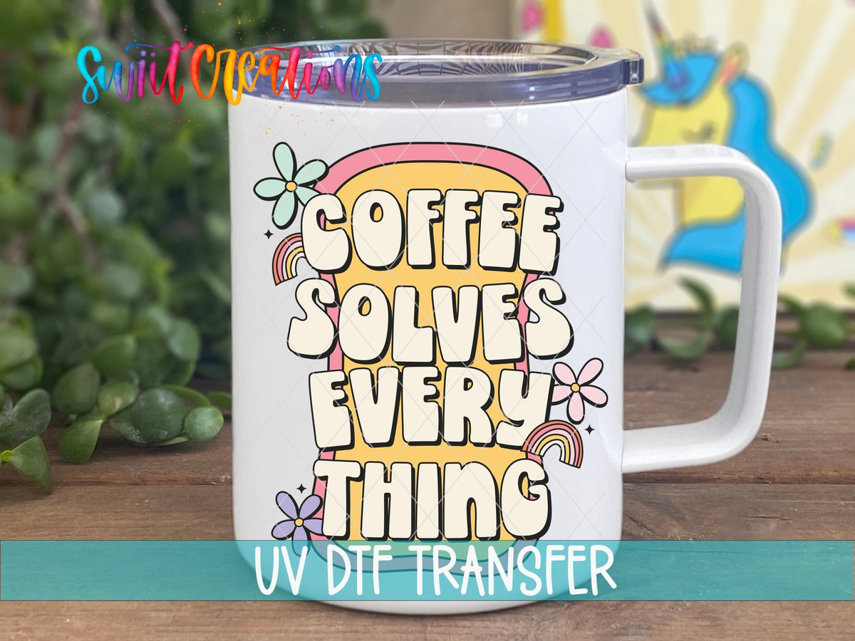 Coffee Solves Everything UV DTF transfer on a white stainless steel mug with a lid