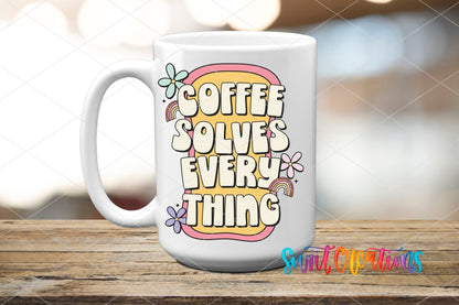 Coffee Solves Everything UV DTF transfer on a white ceramic coffee mug