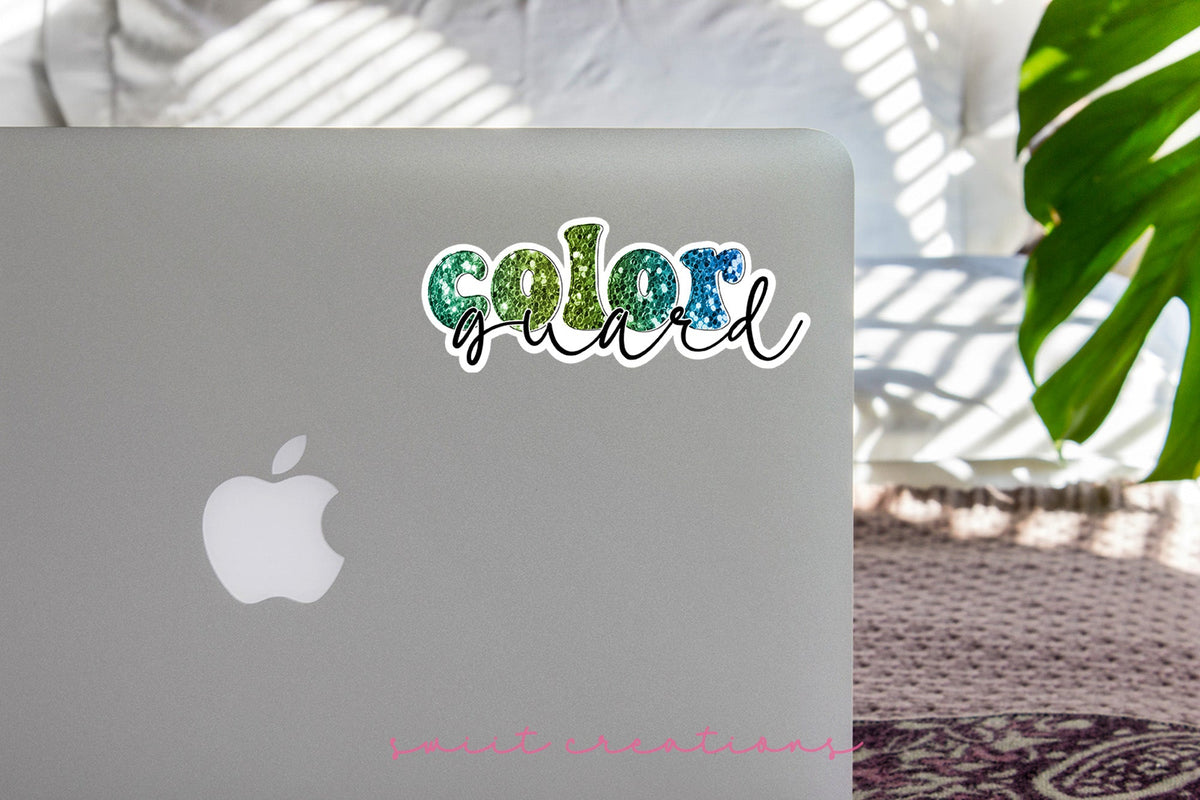 Green Glitter Color Guard sticker on the lid of a silver laptop