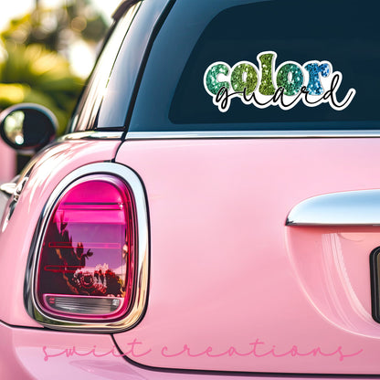 Green Glitter Color Guard sticker on the back window of a pink car