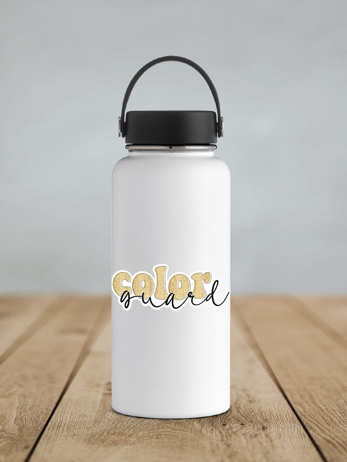 Gold Glitter Color Guard sticker on a white insulated water bottle