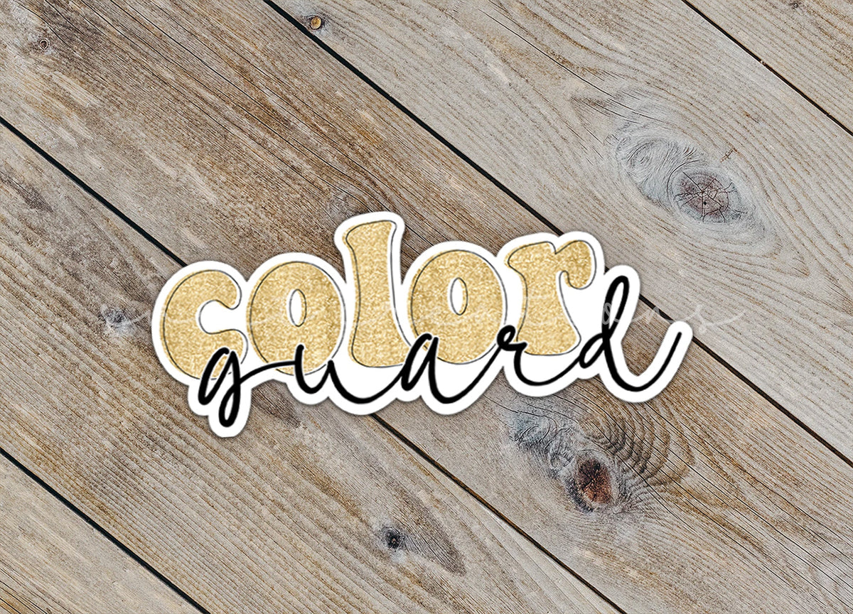 Close-up of the Gold Glitter Color Guard sticker on rustic wood