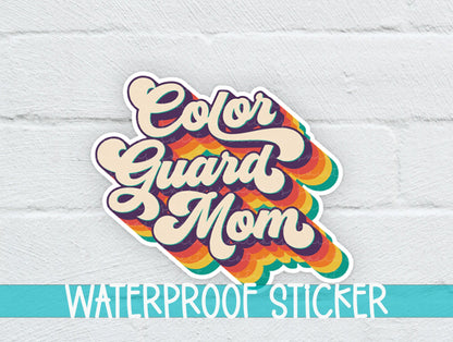Retro Color Guard Mom sticker on a white brick background with a waterproof sticker banner