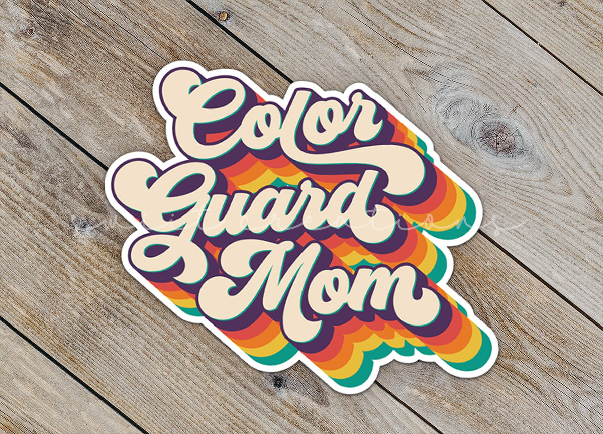 Close-up of the Retro Color Guard Mom sticker on rustic wood