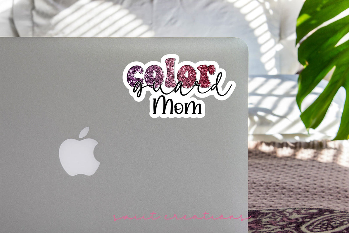 Maroon Glitter Color Guard Mom sticker on the lid of a silver laptop