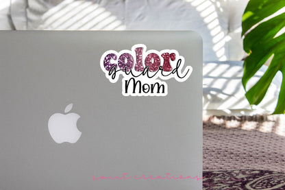 Maroon Glitter Color Guard Mom sticker on the lid of a silver laptop