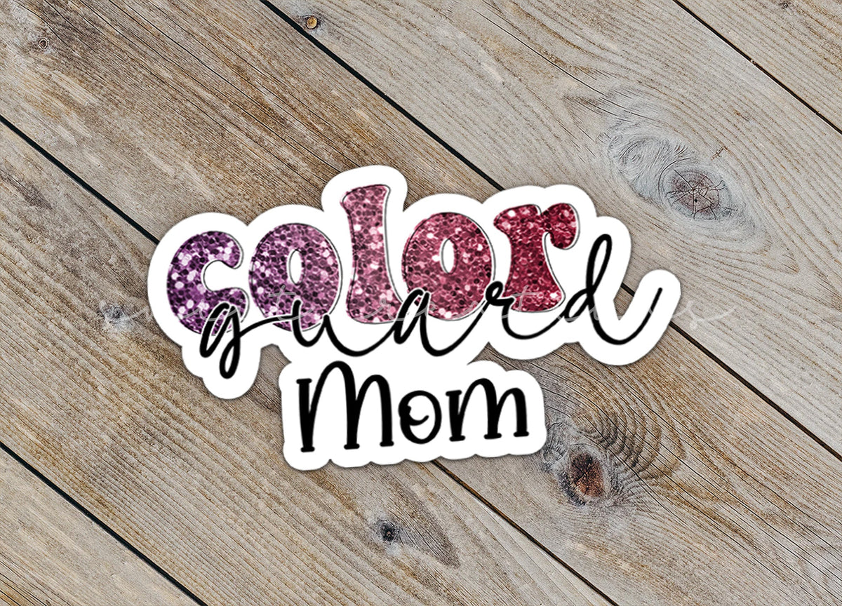 Close-up of the Maroon Glitter Color Guard Mom sticker on rustic wood