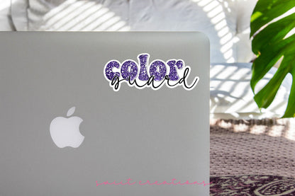 Purple Glitter Color Guard sticker on the lid of a silver laptop