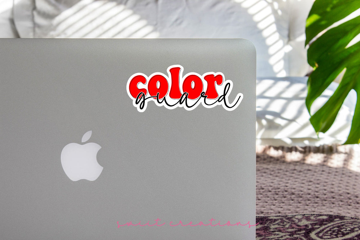 Red Retro Color Guard sticker on the lid of a silver laptop