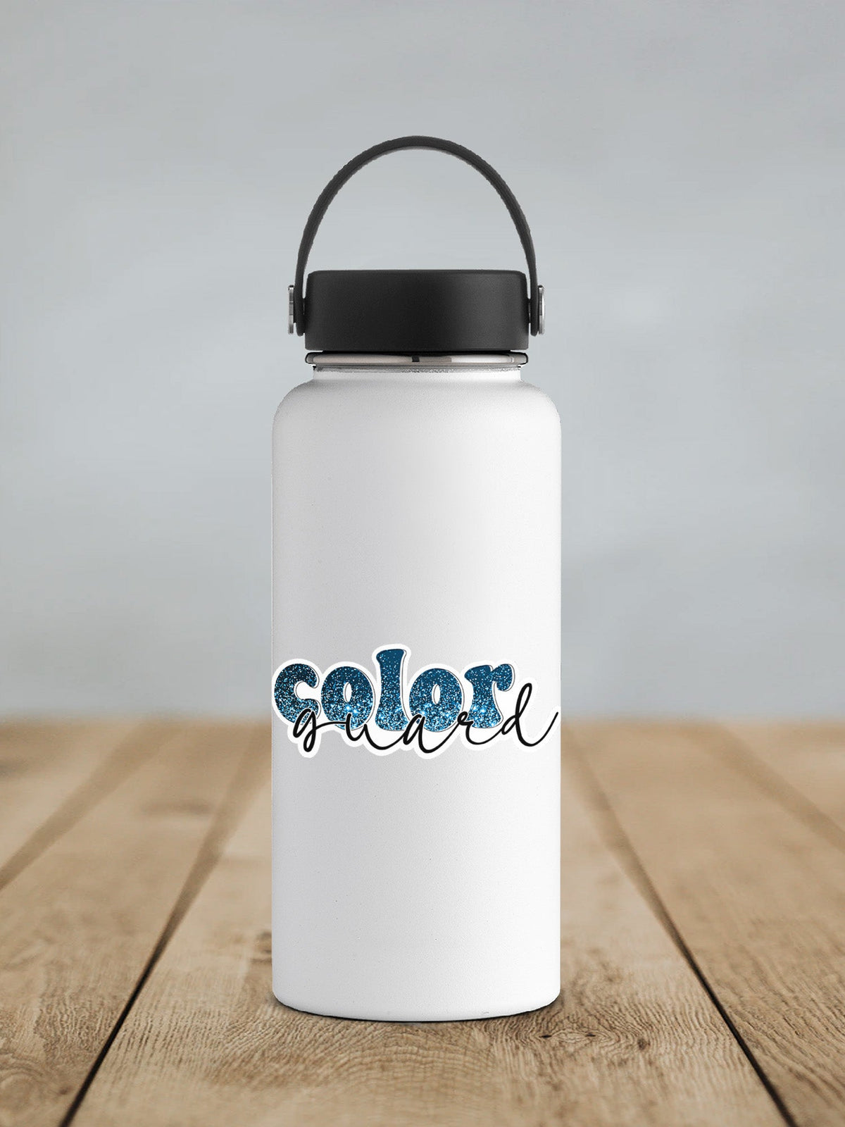 Blue Glitter Color Guard sticker on a white insulated water bottle