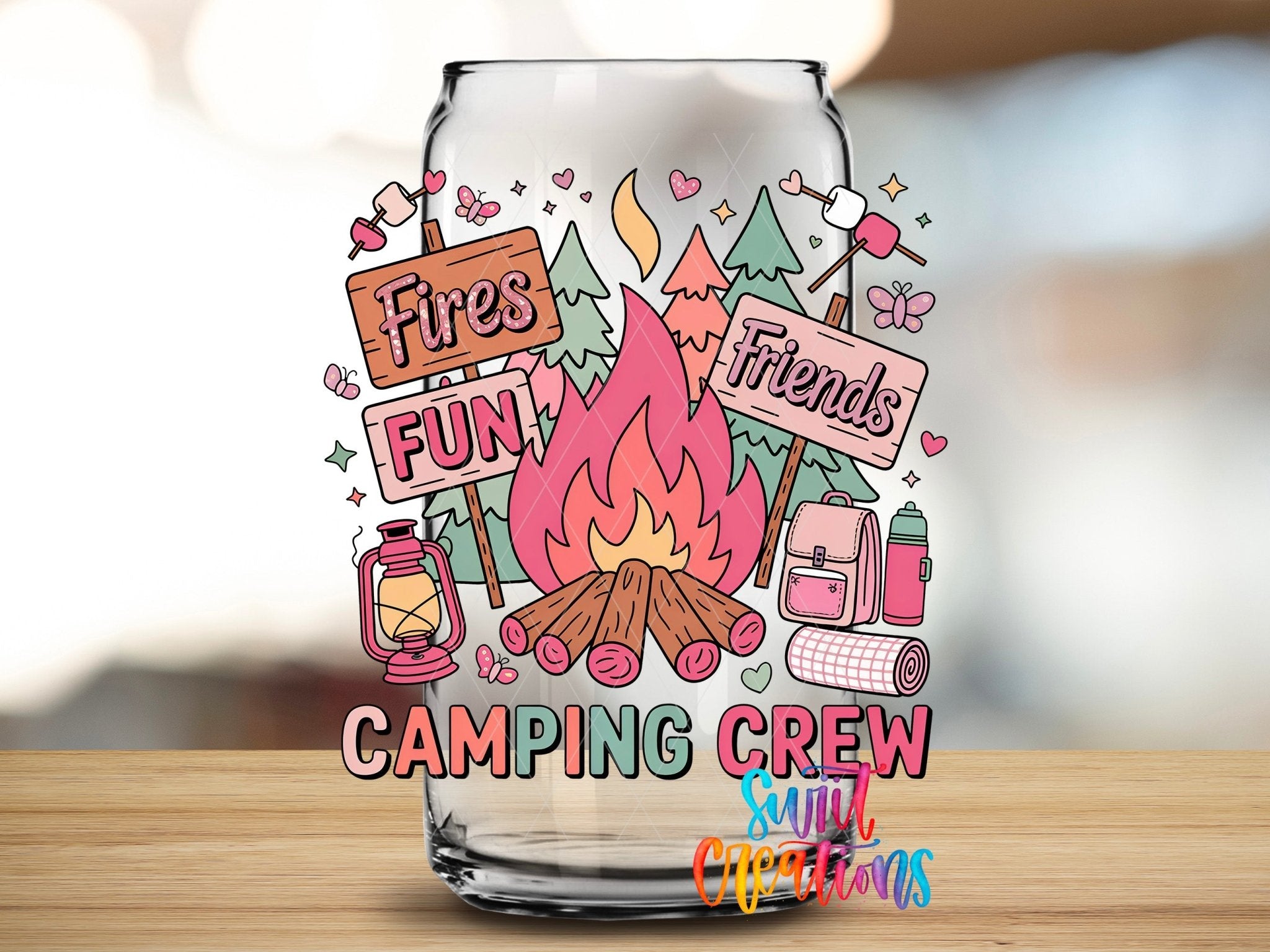 Colorful Fun Camping Crew for Friends UV DTF transfer applied to a clear glass can from Swiit Creations