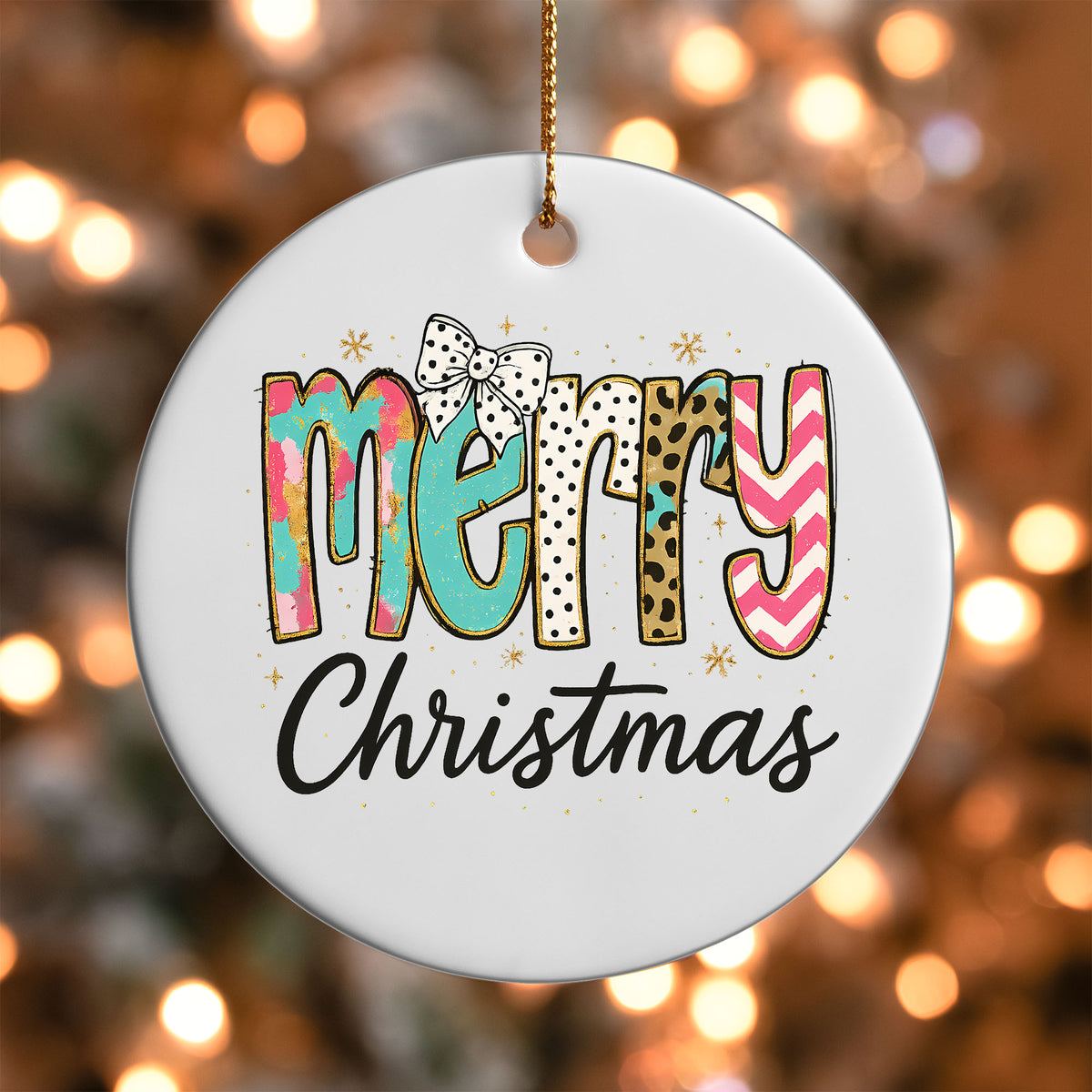 Colorful Merry Christmas ornament UV DTF transfer on a round white ornament with a bokeh light background