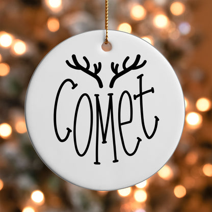 Comet Reindeer Name ornament UV DTF transfer on a round white ornament with a bokeh light background