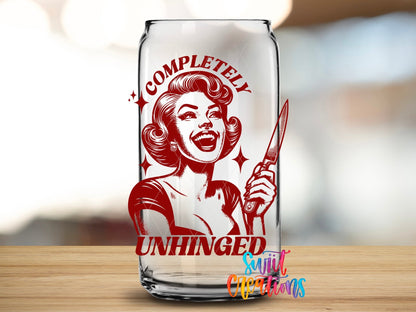Close-up of the Completely Unhinged UV DTF transfer on a clear glass can
