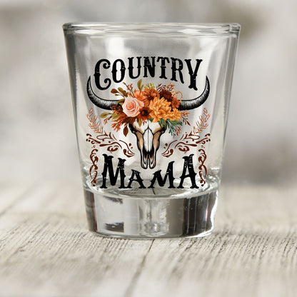 Country Mama shot glass UV DTF transfer with cow skull with orange and rust flowers on a clear shot glass