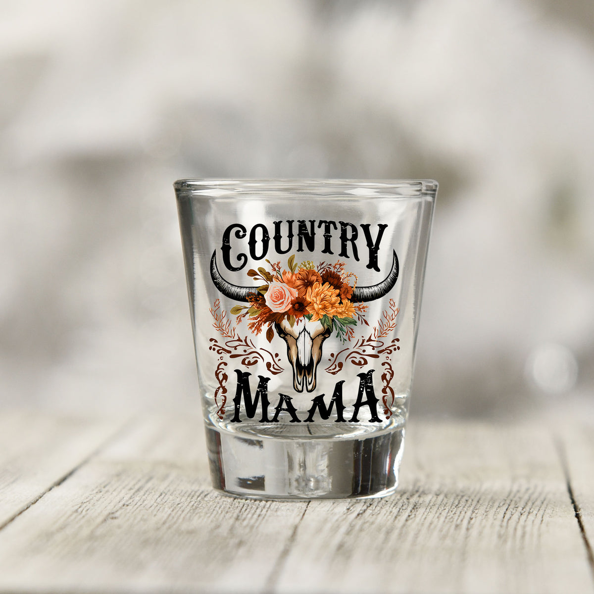 Close-up of the Country Mama UV DTF transfer on a clear shot glass