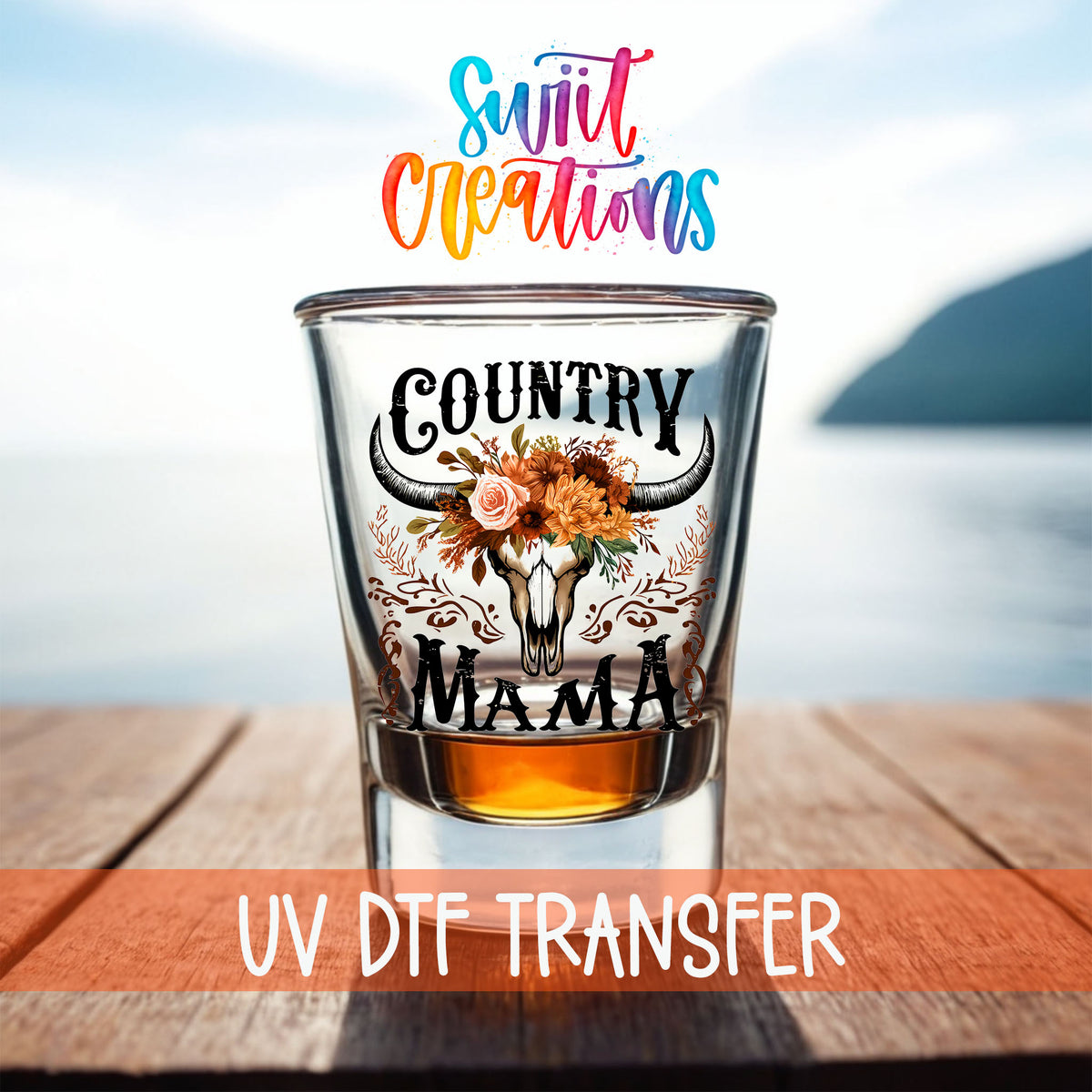 Country Mama shot glass UV DTF transfer on a filled shot glass on a dock by the water